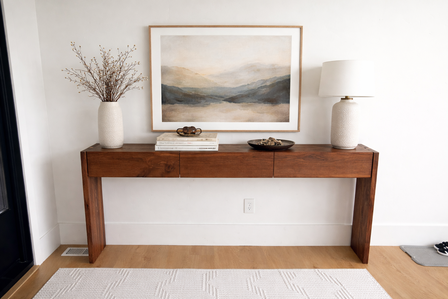 Walnut entryway table styled in room
